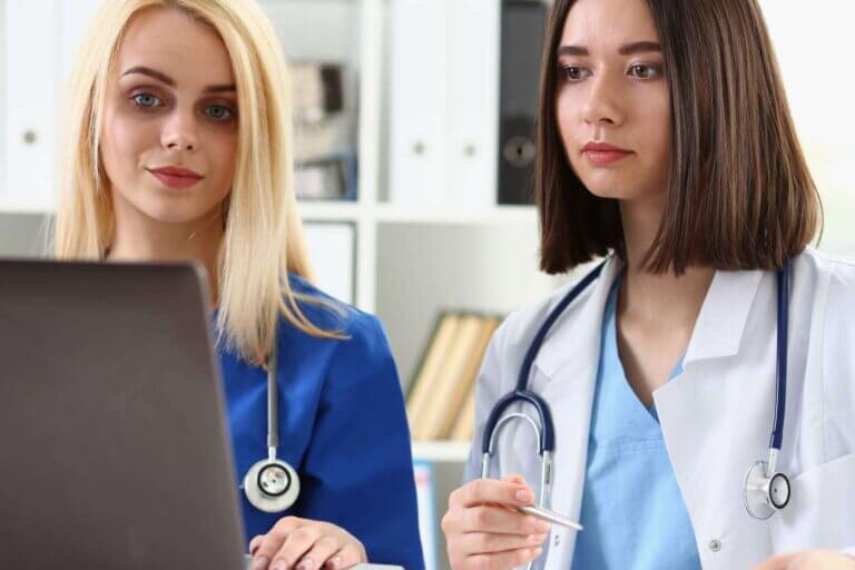 Group of doctors using laptop pc sitting in office