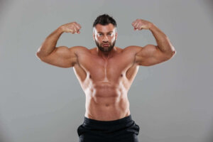 muscular strong shirtless male bodybuilder