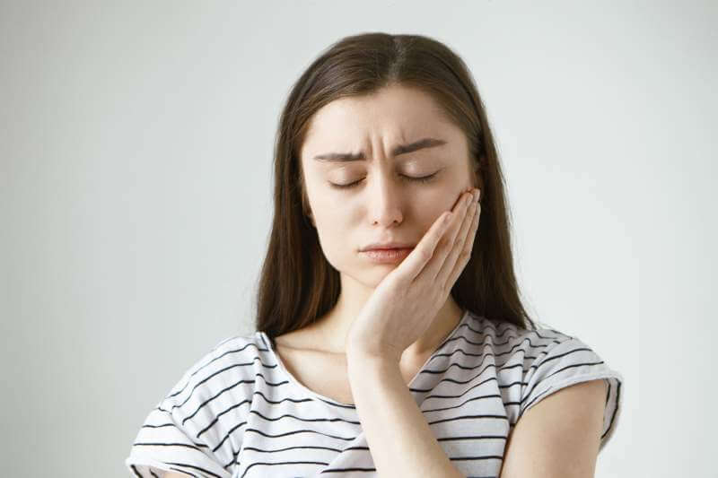unhappy young woman Tooth Pain