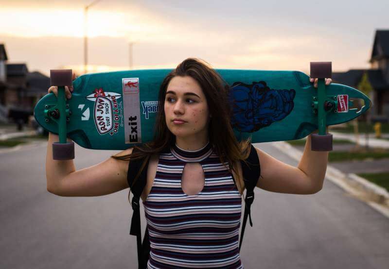 woman-holding-wheel-cut-out-longboard