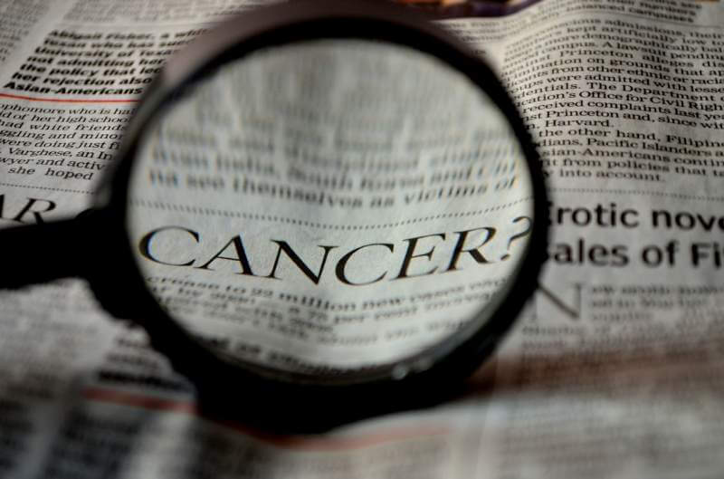 cancer-newspaper-word-magnifier