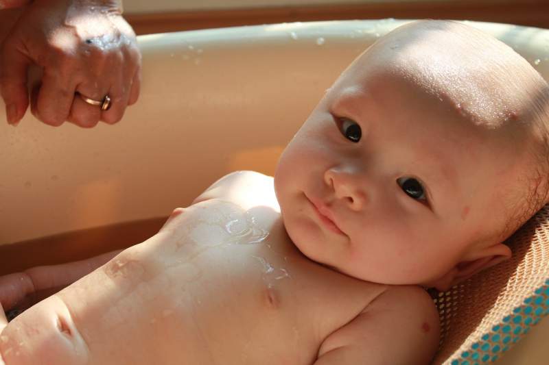 baby-sunny-bath-smiling-child